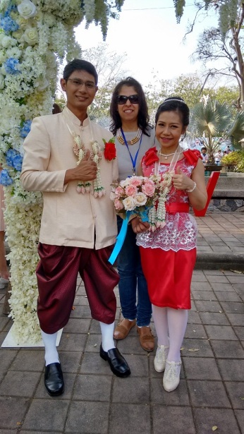 Posing with a Thai couple